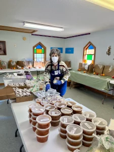 Harpswell Aging at Home volunteer Cheryl Dunning packs bags of food for delivery to Meals in a Pinch recipients.