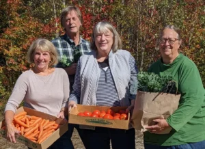 Harpswell Aging at Home volunteers display some of the produce available through the Sharing Tables program. From left: Marie Durant, Dan Hoebeke, Ellen Hoebeke and Julie Moulton.